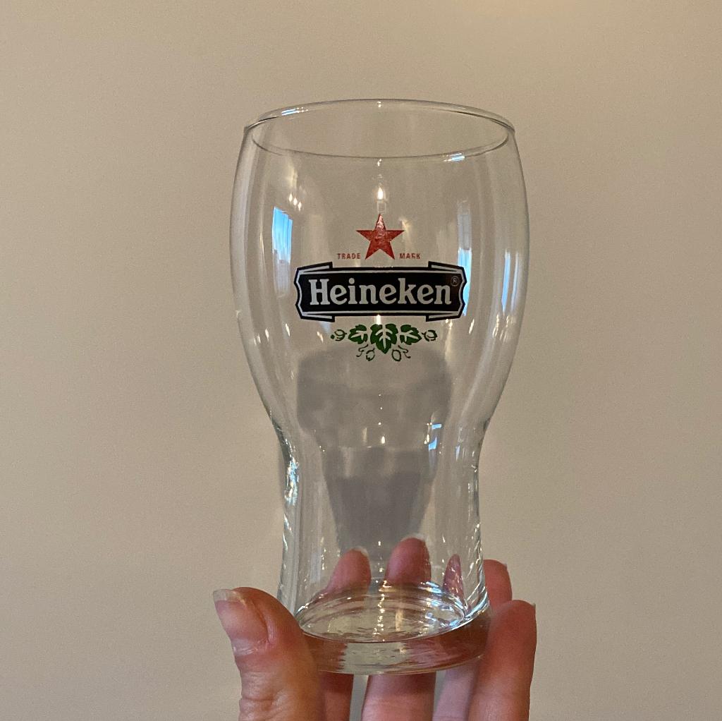 Heineken glazen 9st, Ophalen of Verzenden, Zo goed als nieuw, Bierglas