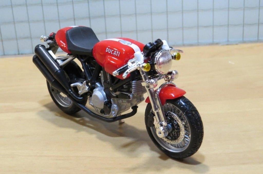 Ducati Sport 1000 red 1:18 Bburago, Hobby en Vrije tijd, Modelauto's | 1:18, Nieuw, Ophalen of Verzenden, Motor, Parc Ariane - Le Vénus