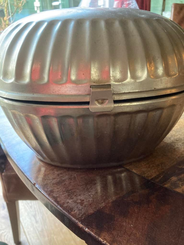 Theemuts of theepotwarm houder, Ophalen