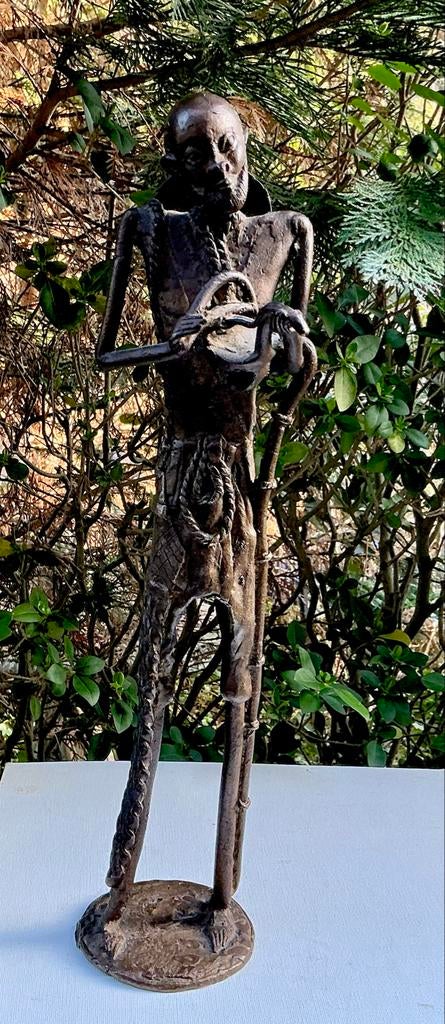 Afrikaans bronzen beeld van een man met muziekinstrument., Ophalen of Verzenden