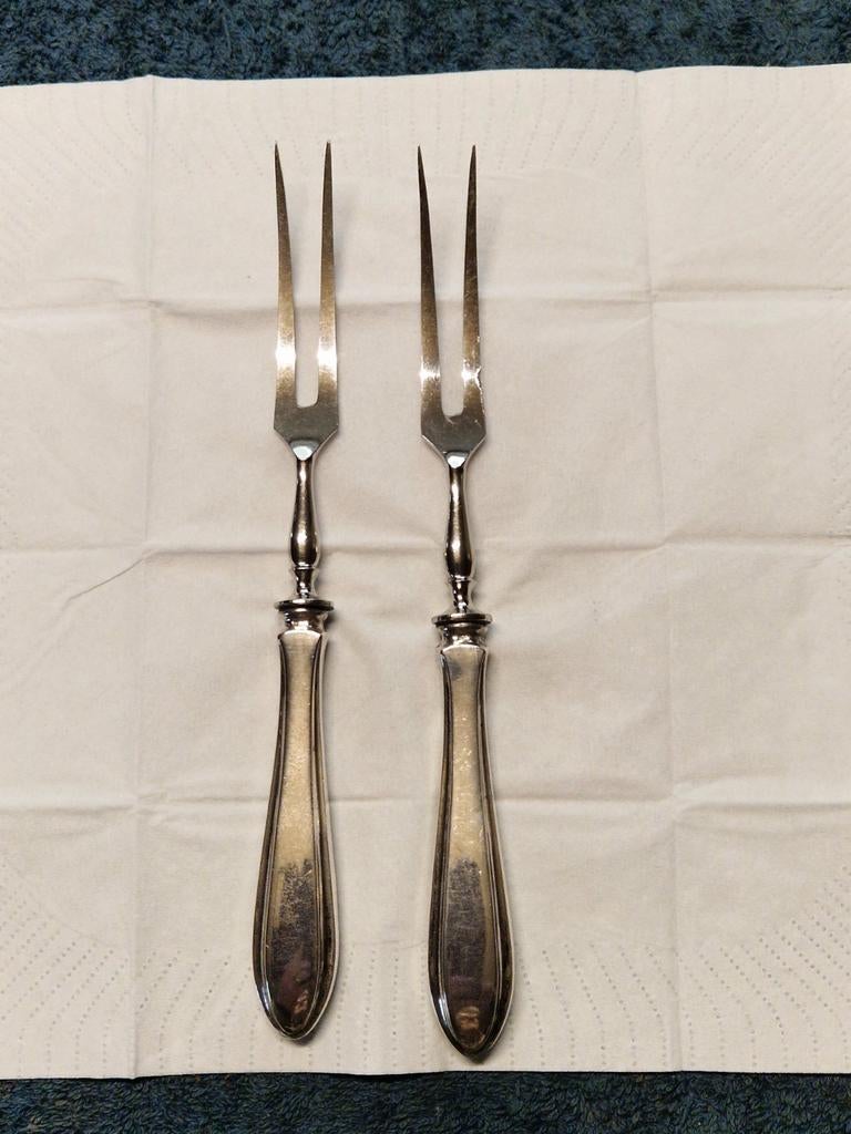 Twee zilveren vleesvorkje is voorzien van een RVS.Vorkinzet, Ophalen of Verzenden