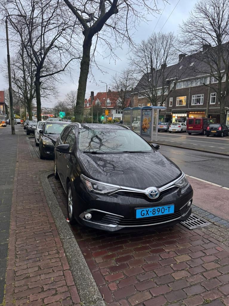 Toyota Auris 1.8 Hybrid Touring Sports CVT 2015 Zwart, Auto's, 345 kg, Zwart, Origineel Nederlands, 1798 cc
