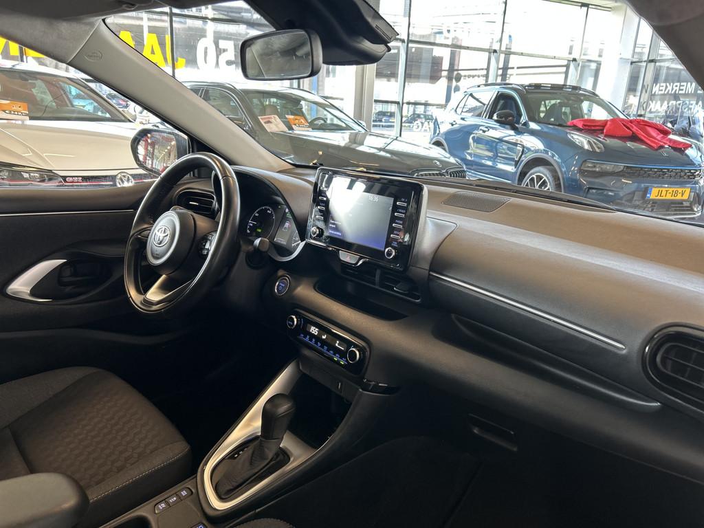Toyota Yaris 1.5 Hybrid 115 Business Automaat | Panoramadak, Gebruikt, Met garantie (alle), 450 kg, Wit