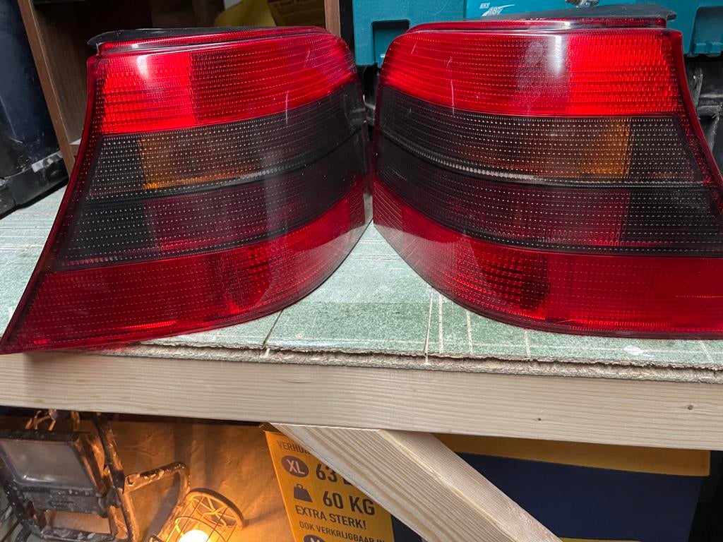Originele HELLA achterlichten Golf 4 smoke, Auto-onderdelen, Verlichting, Ophalen of Verzenden, Volkswagen