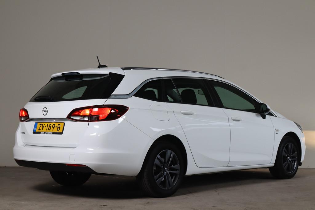 Opel Astra Sports Tourer 1.0 Turbo 120 Jaar Edition NL-Auto!, Auto's, Stof, Gebruikt, Euro 6, 1178 kg