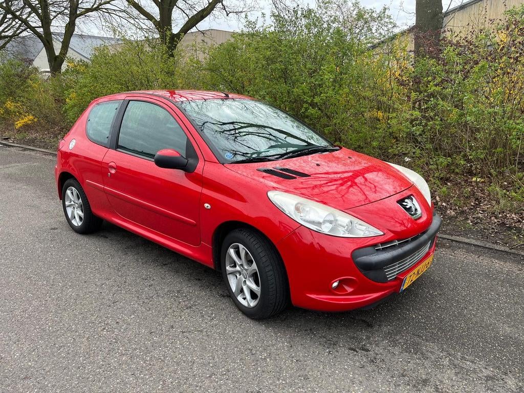 Peugeot 206+ 1.4 3D 2010 Rood, Auto's, Voorwielaandrijving, 206+, Stof, 4 cilinders