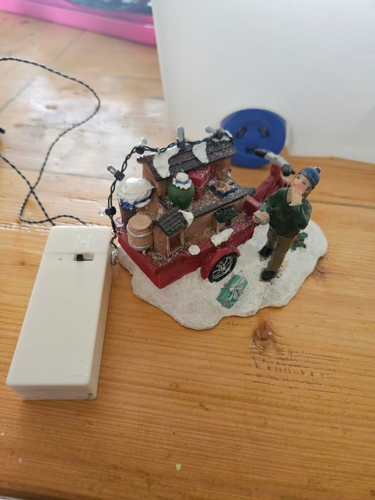 Straatverkoper kerstdorp, Ophalen