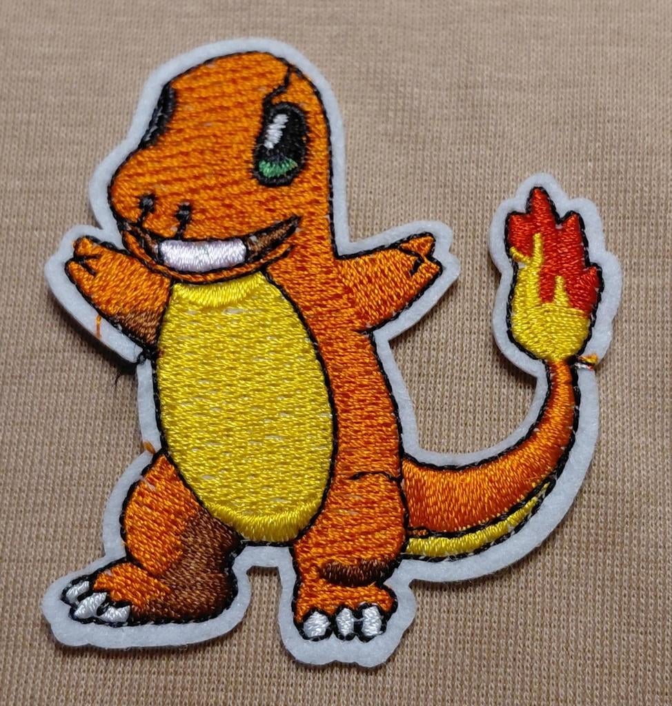 Opstrijkbare geborduurde applicatie  Charmander, Ophalen of Verzenden, Nieuw, Overige applicaties