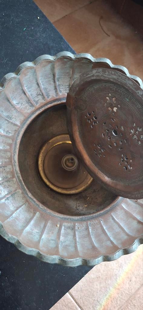 Antieke koperen olielamp, Ophalen