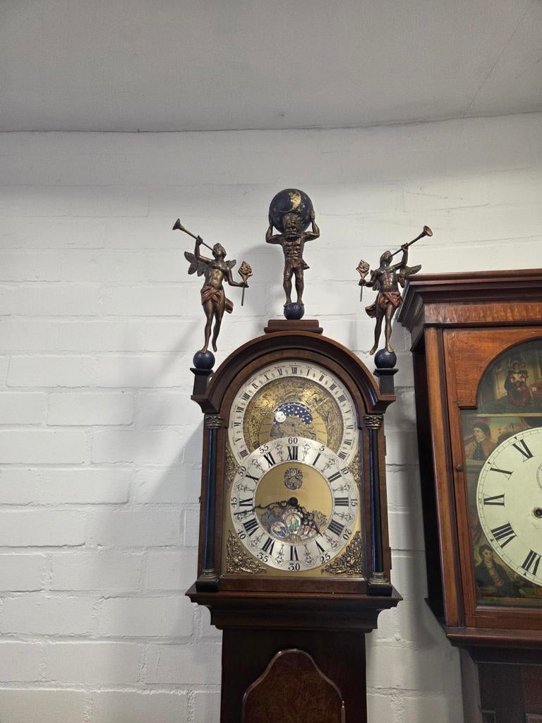 Christiaan Huygens staande klok met planetarium, Ophalen