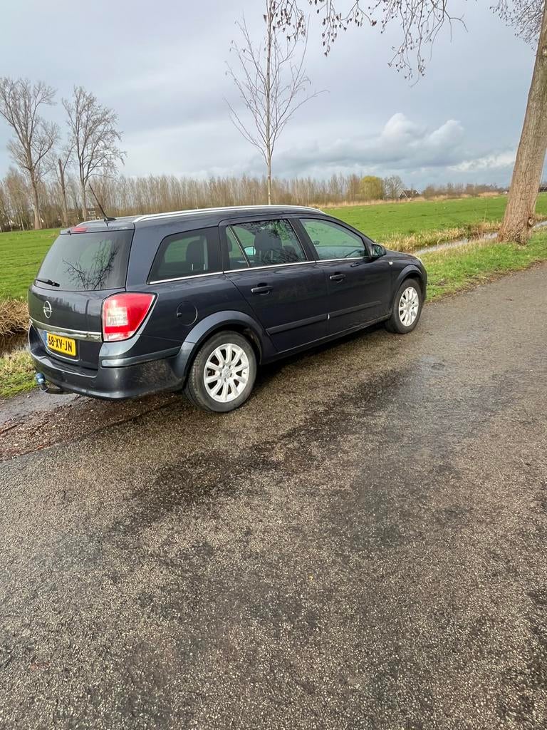 Opel Astra 1.6 16V 85KW St.wgn. 2007 Grijs, Auto's, 657 kg, 15 km/l, Zwart, 4 cilinders