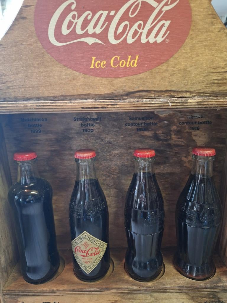 Oude cola flesjes met inhoud, Ophalen, Gebruikt