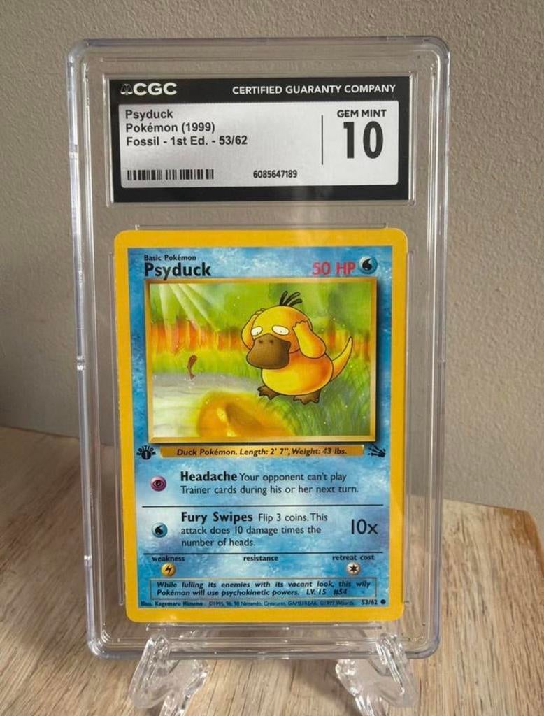Psyduck Pokémon kaart (1999) Fossil - 1st Ed. - 53/62 CGC 10, Ophalen of Verzenden, Zo goed als nieuw, Losse kaart