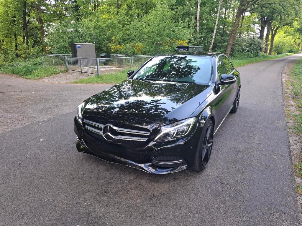 Mercedes-Benz C-Klasse C180  115KW 2014 Zwart, Auto's, Mercedes-Benz, Achterwielaandrijving, 1295 kg, 4 cilinders, Zwart