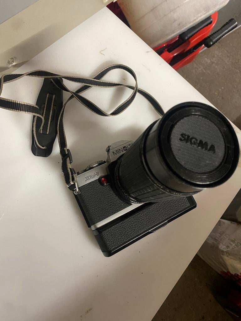 Minolta XG-1 Spiegelreflexcamera met Sigma Zoomlens, Audio, Tv en Foto, Fotocamera's Analoog, Ophalen of Verzenden, Gebruikt, Spiegelreflex
