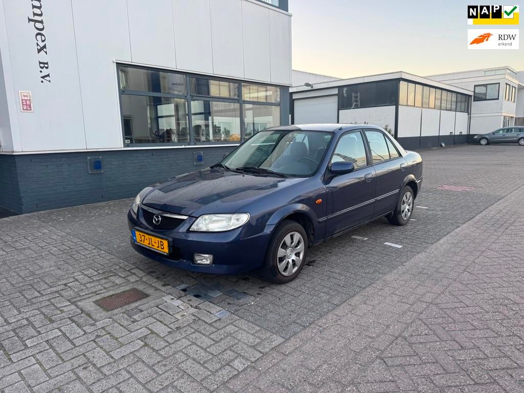 Mazda 323 1.6i Touring Airco Sedan, Auto's, Mazda, Bedrijf, Te koop, ABS, Airbags, Airconditioning, Centrale vergrendeling, Elektrische buitenspiegels