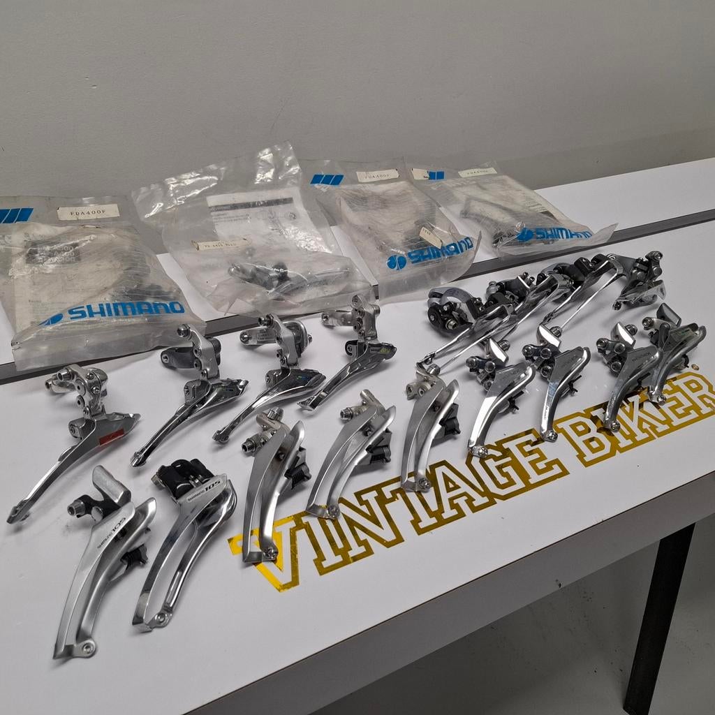 Partij (ca. 20) Retro Shimano Voorderailleurs deels NOS, Fietsen en Brommers, Fietsonderdelen, Ophalen of Verzenden, Zo goed als nieuw