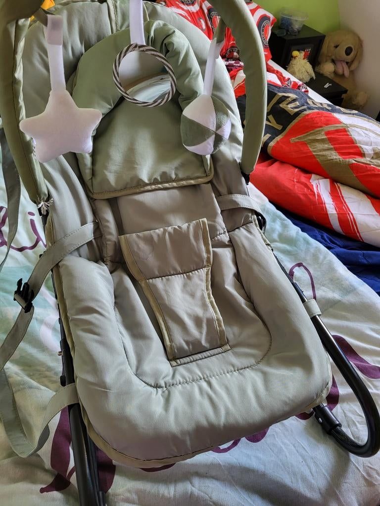 Groene wipstoel met speelboog, Ophalen