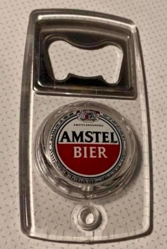 Amstel bier opener/flesopener. Lengte 8,5 cm Breedte 4,5 cm., Ophalen of Verzenden, Zo goed als nieuw, Gebruiksvoorwerp