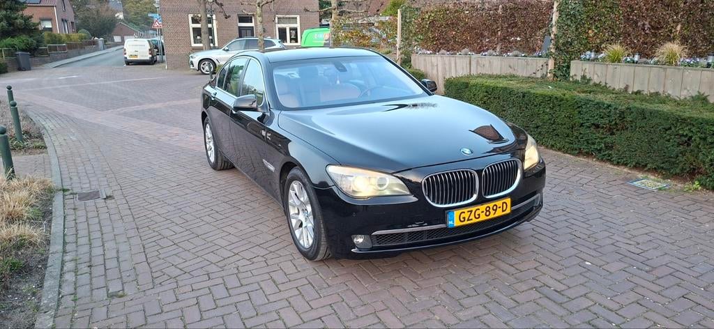 BMW 7-Serie 3.0 I 740 AUT 2009 Zwart, Auto's, Automaat, Achterwielaandrijving, Beige, USB